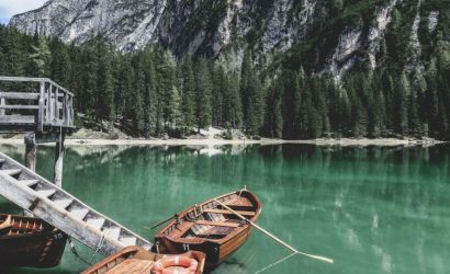Traveler hiking through lush forest trail – perfect for holiday activities and adventure holiday packages